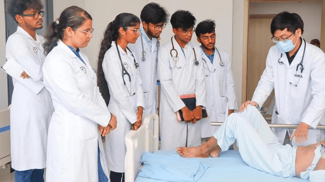 Medical students observing a clinical training session with a patient
